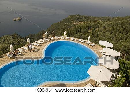 High angle view of tourists at a resort pool, Corfu, Ionian Islands, Greece View Large Photo Image Stock Image - High angle view of tourists at a resort pool, Corfu, Ionian Islands, Greece. Fotosearch
