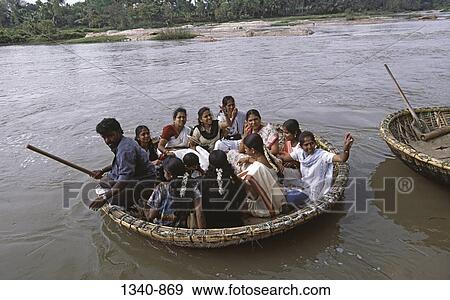 High angle view of tourists in a coracle, Kaveri River, Shrirangapattana, Karnataka, India View Large Photo Image Stock Photo - High angle view of tourists in a coracle, Kaveri River, Shrirangapattana, Karnataka, India. Fotosearch