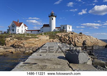 Stock Image - Lighthouse on an island, Eastern Point Lighthouse, Gloucester, Cape Ann, Massachusetts, USA. Fotosearch