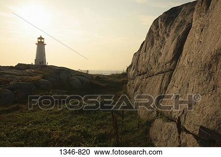 Lighthouse on the beach at dusk, Peggy's Cove Lighthouse, Peggy's Cove, Nova Scotia, Canada View Large Photo Image Stock Image - Lighthouse on the beach at dusk, Peggy's Cove Lighthouse, Peggy's Cove, Nova Scotia, Canada. Fotosearch