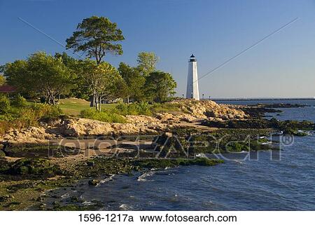 Stock Image - Lighthouse on the coast, New Haven Lighthouse, Lighthouse Point Park, New Haven, Connecticut, USA. Fotosearch