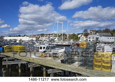 Lobster traps and lobster buoys on a fishing pier, Gloucester, Cape Ann, Massachusetts, USA View Large Photo Image Stock Photo - Lobster traps and lobster buoys on a fishing pier, Gloucester, Cape Ann, Massachusetts, USA. Fotosearch