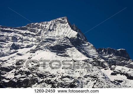 Low angle view of a mountain covered with snow, Kongde Ri, Sagarmatha National Park, Khumbu, Nepal View Large Photo Image Stock Photo - Low angle view of a mountain covered with snow, Kongde Ri, Sagarmatha National Park, Khumbu, Nepal. Fotosearch