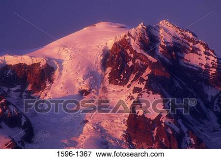 Low angle view of a snow covered mountain, Mt Rainier, Gifford Pinchot National Forest, Washington State, USA View Large Photo Image Stock Photo - Low angle view of a snow covered mountain, Mt Rainier, Gifford Pinchot National Forest, Washington State, USA. Fotosearch