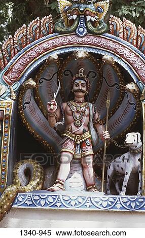 Low angle view of a statue of a guardian deity in a temple, Kochadai, Madurai, Tamil Nadu, India View Large Photo Image Stock Photography - Low angle view of a statue of a guardian deity in a temple, Kochadai, Madurai, Tamil Nadu, India. Fotosearch