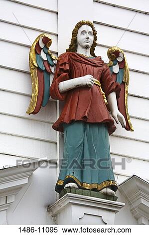 Low angle view of a statue on a building, Historic Bryggen District, Bergen, Norway View Large Photo Image Stock Photography - Low angle view of a statue on a building, Historic Bryggen District, Bergen, Norway. Fotosearch