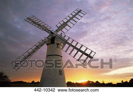 Stock Image - Low angle view of a traditional windmill, Thurne, Norfolk Broads, Norfolk, England. Fotosearch
