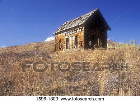 Stock Image - Low angle view of an abandoned ranch house, Methow Wildlife Area, Washington State, USA. Fotosearch