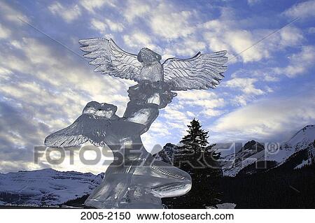Low angle view of an ice sculpture with mountains in the background, Mount Victoria, Banff National Park, Alberta, Canada View Large Photo Image Stock Image - Low angle view of an ice sculpture with mountains in the background, Mount Victoria, Banff National Park, Alberta, Canada. Fotosearch