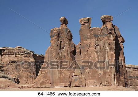 Stock Photograph - Low angle view of rock formations on a landscape, Three Gossips, Arches National Park, Utah, USA. Fotosearch