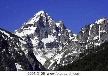 Stock Photography - Low angle view of snow covered mountains, Grand Teton, Grand Teton National Park, Wyoming, USA. Fotosearch