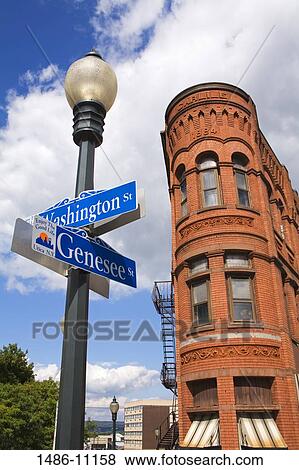 Low angle view of street name signs in front of a building, Carlile Building, Utica, New York State, USA View Large Photo Image Stock Photo - Low angle view of street name signs in front of a building, Carlile Building, Utica, New York State, USA. Fotosearch