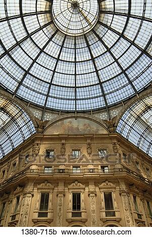Stock Image - Low angle view of the ceiling of a shopping mall, Galleria Vittorio Emanuele II, Milan, Lombardy, Italy. Fotosearch