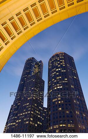 Low angle view of two towers lit up at dusk, One International Place, Rowe's Wharf, Boston Harbor, Boston, Massachusetts, USA View Large Photo Image Stock Photo - Low angle view of two towers lit up at dusk, One International Place, Rowe's Wharf, Boston Harbor, Boston, Massachusetts, USA. Fotosearch