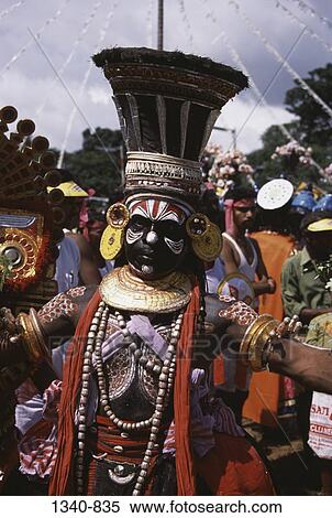 Stock Photography - Man performing Theyyam dance, Kerala, India. Fotosearch