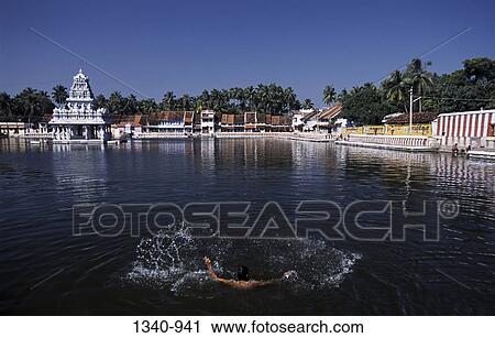 Man swimming in a pond of a temple, Thanumalayan temple, Suchindram, Tamil Nadu, India View Large Photo Image Stock Image - Man swimming in a pond of a temple, Thanumalayan temple, Suchindram, Tamil Nadu, India. Fotosearch