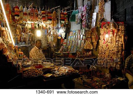 Market stall in the corridor of a temple, Sri Meenakshi Hindu Temple, Madurai, Tamil Nadu, India View Large Photo Image Stock Image - Market stall in the corridor of a temple, Sri Meenakshi Hindu Temple, Madurai, Tamil Nadu, India. Fotosearch