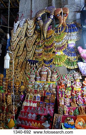 Market stall in the corridor of a temple, Sri Meenakshi Hindu Temple, Madurai, Tamil Nadu, India View Large Photo Image Stock Image - Market stall in the corridor of a temple, Sri Meenakshi Hindu Temple, Madurai, Tamil Nadu, India. Fotosearch