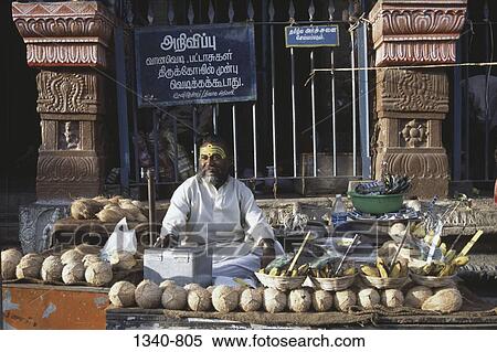 Mature man selling religious offerings at a market stall, Sri Subramanya Swamy Temple, Tirupparamkunram, Tamil Nadu, India View Large Photo Image Stock Photography - Mature man selling religious offerings at a market stall, Sri Subramanya Swamy Temple, Tirupparamkunram, Tamil Nadu, India. Fotosearch