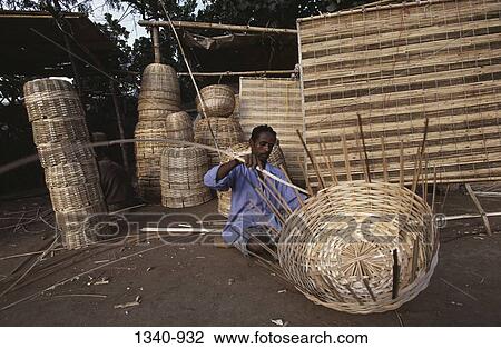 Mature man weaving a basket from bamboo strips, Tamil Nadu, India View Large Photo Image Stock Image - Mature man weaving a basket from bamboo strips, Tamil Nadu, India. Fotosearch