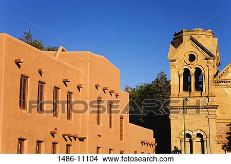Museum near a cathedral, Institute of American Indian Arts Museum, St. Francis Cathedral, Santa Fe, New Mexico, USA View Large Photo Image Picture - Museum near a cathedral, Institute of American Indian Arts Museum, St. Francis Cathedral, Santa Fe, New Mexico, USA. Fotosearch