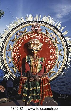 Person in a Theyyam dance costume, Kerala, India View Large Photo Image Picture - Person in a Theyyam dance costume, Kerala, India. Fotosearch