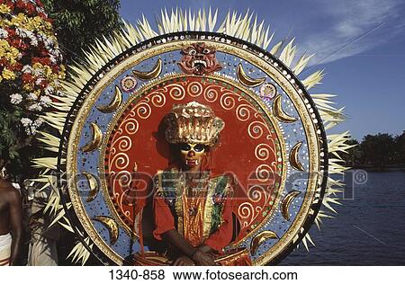 Stock Photo - Person in a Theyyam dance costume, Kerala, India. Fotosearch