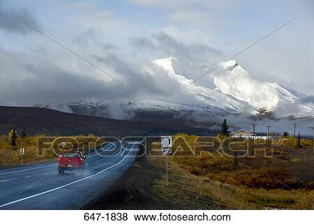 Pick-up truck on a wet highway, Glenn Highway, Alaska, USA View Large Photo Image Stock Photo - Pick-up truck on a wet highway, Glenn Highway, Alaska, USA. Fotosearch