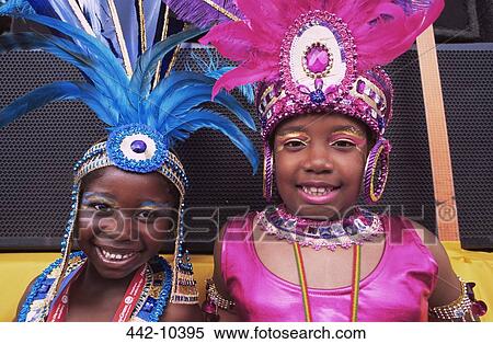 Portrait of a girl and a boy performing in a carnival, Notting Hill Carnival, London, England View Large Photo Image Stock Photography - Portrait of a girl and a boy performing in a carnival, Notting Hill Carnival, London, England. Fotosearch