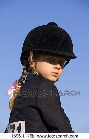 Stock Image - Portrait of a girl in equestrian clothing, Jefferson, Oregon, USA. Fotosearch