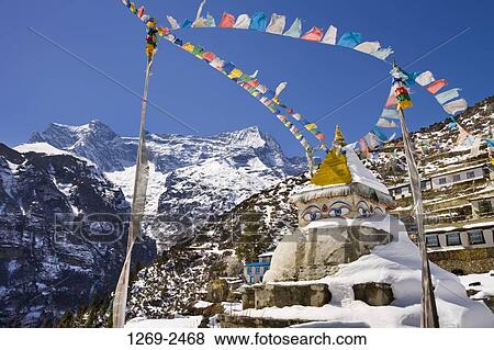 Prayer flags hanging over a pagoda, Namche Bazar, Kongde Ri, Sagarmatha National Park, Nepal View Large Photo Image Stock Photo - Prayer flags hanging over a pagoda, Namche Bazar, Kongde Ri, Sagarmatha National Park, Nepal. Fotosearch
