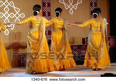 Rear view of three women performing Kathak, a classical dance of India, India View Large Photo Image Stock Photograph - Rear view of three women performing Kathak, a classical dance of India, India. Fotosearch