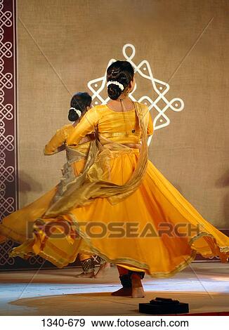 Rear view of two women performing Kathak, a classical dance of India, India View Large Photo Image Stock Photo - Rear view of two women performing Kathak, a classical dance of India, India. Fotosearch