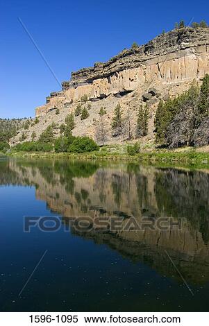 Reflection of a hill in a river, Deschutes Wild and Scenic River, Steelhead Falls Wilderness Study Area, Oregon, USA View Large Photo Image Stock Photography - Reflection of a hill in a river, Deschutes Wild and Scenic River, Steelhead Falls Wilderness Study Area, Oregon, USA. Fotosearch