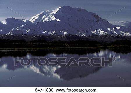 Stock Image - Reflection of a snow covered mountain in a pond, Mt McKinley, Denali National Park, Alaska, USA. Fotosearch