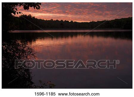 Reflection of clouds in a lake at sunrise, West Hartford Reservoir, West Hartford, Connecticut, USA View Large Photo Image Stock Photography - Reflection of clouds in a lake at sunrise, West Hartford Reservoir, West Hartford, Connecticut, USA. Fotosearch
