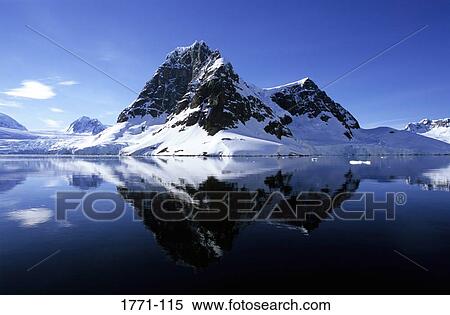 Reflection of snow covered mountains in water, Lemaire Channel, Antarctica View Large Photo Image Stock Photography - Reflection of snow covered mountains in water, Lemaire Channel, Antarctica. Fotosearch