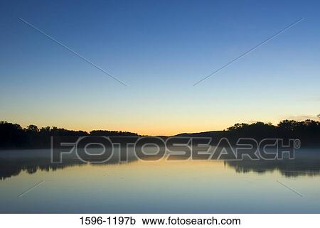 Reflection of trees in a river at dawn, Connecticut River, Ferry Park, Rocky Hill, Connecticut, USA View Large Photo Image Stock Image - Reflection of trees in a river at dawn, Connecticut River, Ferry Park, Rocky Hill, Connecticut, USA. Fotosearch
