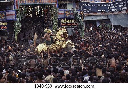 Ritual spraying of water on God Vishnu mounted on Golden horse during Chitra festival, Madurai, Tamil Nadu, India View Large Photo Image Stock Photo - Ritual spraying of water on God Vishnu mounted on Golden horse during Chitra festival, Madurai, Tamil Nadu, India. Fotosearch
