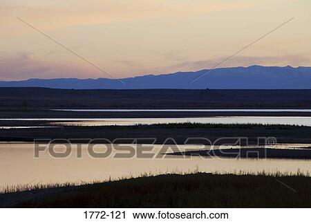 River with a mountain range in the background, Wind River, Boysen State Park, Wyoming, USA View Large Photo Image Stock Image - River with a mountain range in the background, Wind River, Boysen State Park, Wyoming, USA. Fotosearch