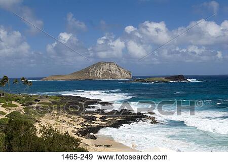 Stock Photo - Rock formations in the sea, Waimanalo Bay, Oahu, Hawaii Islands, USA. Fotosearch
