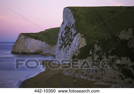 Rock formations on the beach, Durdle Door, Dorset, England View Large Photo Image Stock Image - Rock formations on the beach, Durdle Door, Dorset, England. Fotosearch