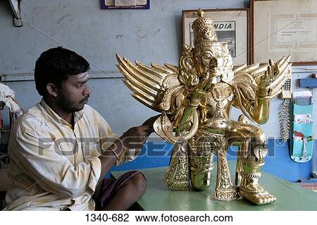 Sculptor making a bronze sculpture of Garuda the vahana of Lord Vishnu in Hindu mythology, Kumbakonam, Thanjavur District, Tamil Nadu, India View Large Photo Image Stock Image - Sculptor making a bronze sculpture of Garuda the vahana of Lord Vishnu in Hindu mythology, Kumbakonam, Thanjavur District, Tamil Nadu, India. Fotosearch