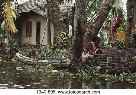 Side profile of a mature woman cleaning fish, Kerala, India View Large Photo Image Stock Photography - Side profile of a mature woman cleaning fish, Kerala, India. Fotosearch