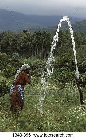 Side profile of a mature woman drinking water, Attappadi, Palakkad District, Kerala, India View Large Photo Image Stock Photograph - Side profile of a mature woman drinking water, Attappadi, Palakkad District, Kerala, India. Fotosearch