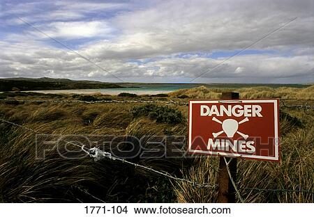 Sign warning of mines on the beach, Port Stanley, Falkland Islands View Large Photo Image Picture - Sign warning of mines on the beach, Port Stanley, Falkland Islands. Fotosearch
