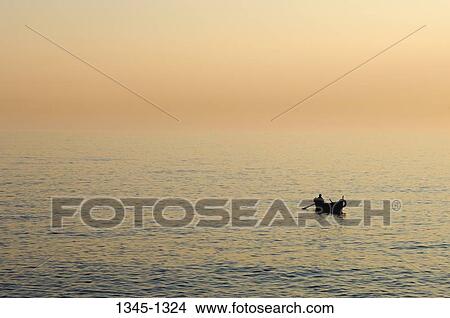 Silhouette of a boat in the sea, Camogli, Liguria, Italy View Large Photo Image Picture - Silhouette of a boat in the sea, Camogli, Liguria, Italy. Fotosearch