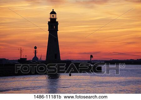 Stock Image - Silhouette of a lighthouse at dusk, Buffalo Lighthouse, Buffalo Port, New York State, USA. Fotosearch