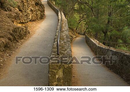 Stone wall along a trail, McArthur-Burney Falls Memorial State Park, California, USA View Large Photo Image Stock Photo - Stone wall along a trail, McArthur-Burney Falls Memorial State Park, California, USA. Fotosearch
