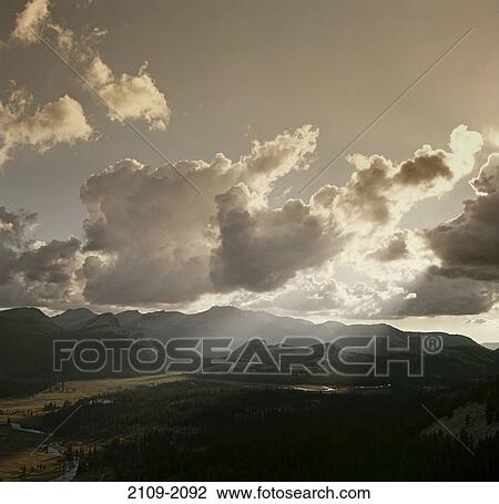 Sunbeams radiating through clouds, Tuolumne Meadows, Tuolumne River, Yosemite National Park, California, USA View Large Photo Image Stock Image - Sunbeams radiating through clouds, Tuolumne Meadows, Tuolumne River, Yosemite National Park, California, USA. Fotosearch
